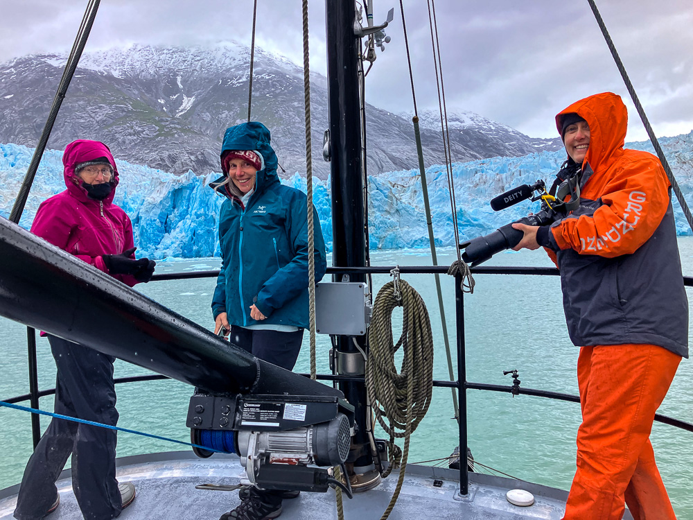 People in front of a glacier in Alaska